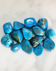 Turquenite Blue Howlite Dyed Tumbled Stone - One Stone - On Tile