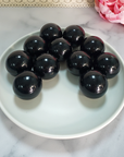 Black Obsidian Natural Crystal Sphere Gemstone Orb Marble - One 30mm Sphere - Group of Black Obsidian Spheres in White Ceramic Dish