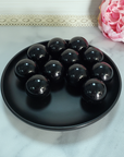 Black Obsidian Natural Crystal Sphere Gemstone Orb Marble - One 30mm Sphere - Group of Black Obsidian Crystal Orbs in Black Ceramic Dish