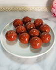 Red Jasper Natural Gemstone Sphere Crystal Orb Marble - One 30mm Sphere - Group of Red Jasper Stone Spheres on White Ceramic Plate