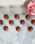 Red Jasper Natural Gemstone Sphere Crystal Orb Marble - One 30mm Sphere - Group of Red Jasper Stone Orbs on Tile
