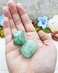 green included quartz crystals in hand