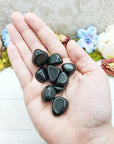 green goldstone crystals in hand
