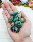 african turquoise stones in hand