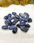 tumbled sodalite crystal pieces on display