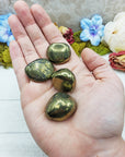 chalcopyrite stones in hand
