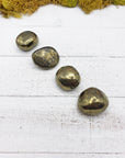 tumbled chalcopyrite stones on board