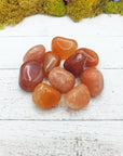 red aventurine crystals on board