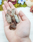 angel phantom quartz stones in hand