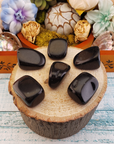 Black Obsidian Natural Tumbled Stone - One Stone - On Wood