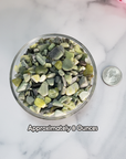 Infinite Serpentine Gemstone Chips By the Ounce - 8 Ounces of Crystal Chips in a Glass Bowl Beside a Quarter for Size Comparison