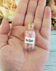 Rose Quartz Crystal Chips Chips in Glass Bottle | Color Enhanced