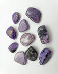 charoite stones on white background