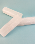 MINI Rough Selenite Crystal Stick - One 2.5 Inch Stick - On Blue Background