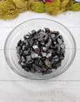 shungite stone pieces in glass bowl