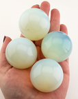 Opalite Crystal Sphere Manmade Gemstone Orb - 35 - 40mm - In Hand Showing Imperfections