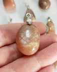 Peach Moonstone Crystal Pendant Natural Gemstone Jewelry - Close Up of Flash on Peach Moonstone Pendant