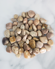 Pink Amethyst Crystal Pebbles Natural Tumbled Stones By the Ounce - on Tile