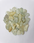 tumbled aquamarine crystals on white background