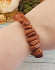 Red Goldstone Manmade Gemstone Nugget Stretch Bracelet - on Hand