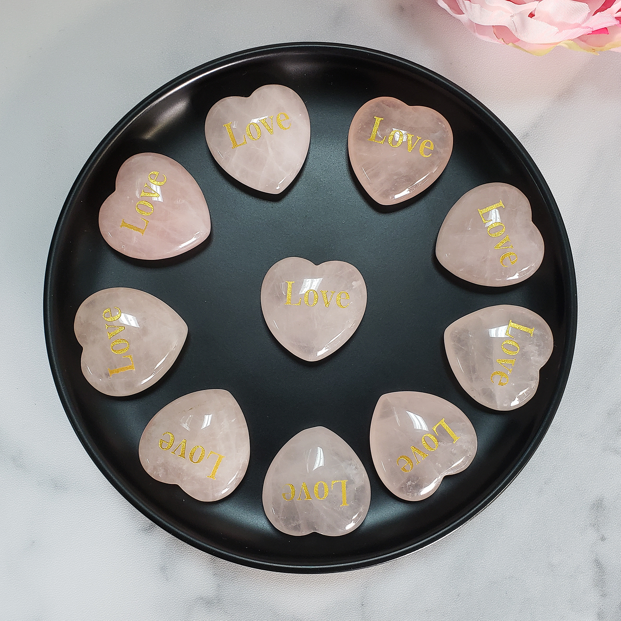 Rose Quartz Crystal Natural Gemstone Heart Carving | Engraved Love Affirmation - Rose Quartz Crystal Hearts on Black Ceramic Bowl
