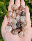 Rutilated Quartz Crystal Natural Gemstone Tumbled Stone - in Sunlight