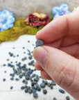 sapphire stone between fingers