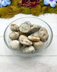 white opal stones in glass bowl