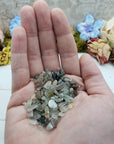 One ounce of mixed agate chips in hand