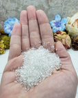 one ounce of quartz crystal chips in hand