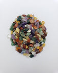 One ounce of mixed gemstone crystal chips on white backgroun
