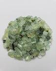 One ounce of prehnite chips on white background