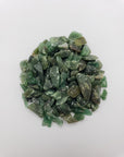 Green aventurine chips on white background