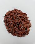 red jasper stone chips on white background