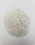 one ounce of quartz crystal chips on white background