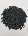 rough shungite stone chips on white background
