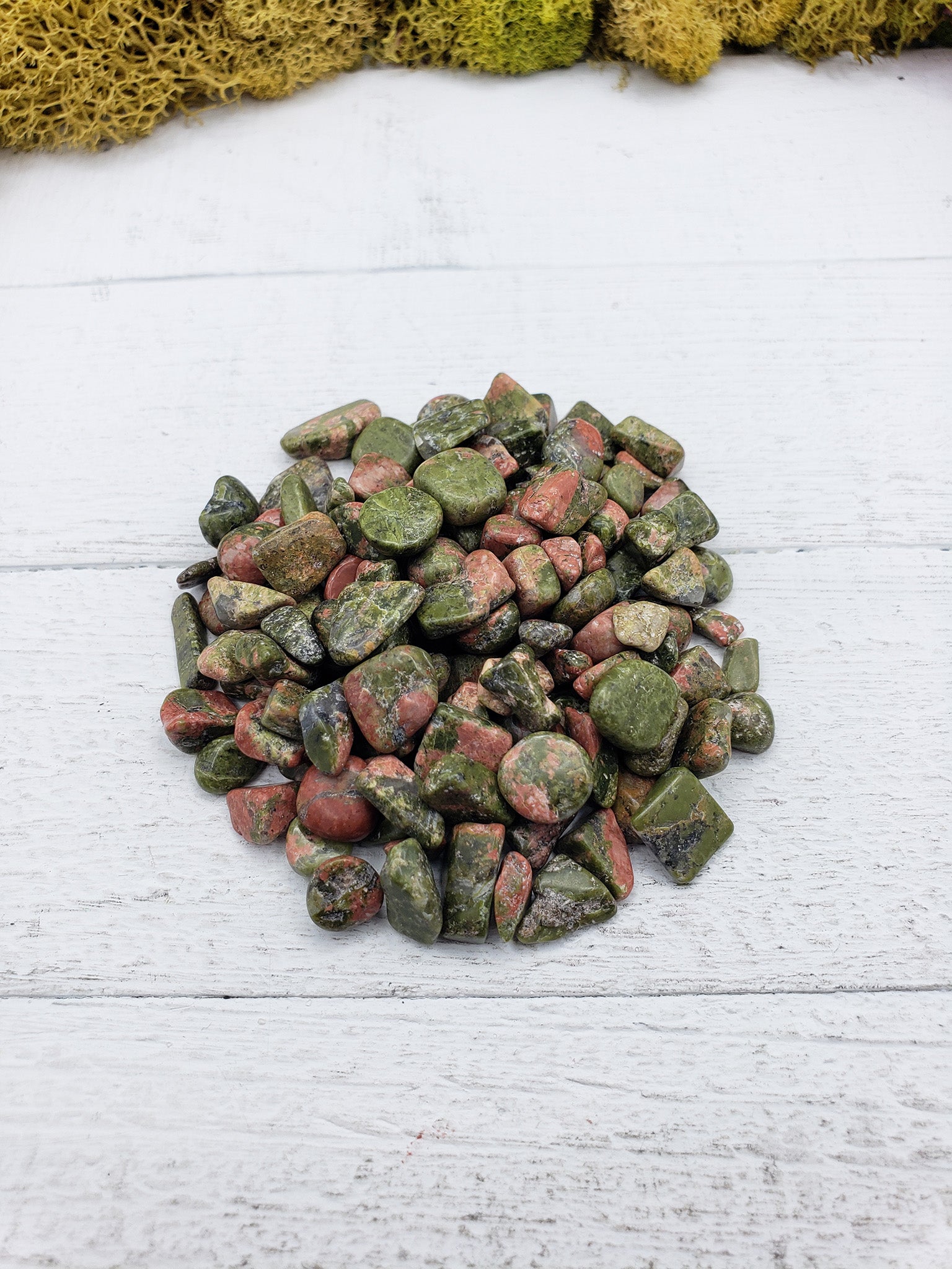 2 ounce of unakite stone chips on display