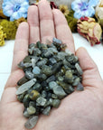 Three ounces of labradorite crystal chips in hand