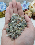 Three ounces of mixed agate crystal chips in hand