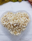 five ounces of bamboo coral chips in selenite bowl