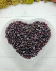 six ounces of garnet stone chips in selenite bowl