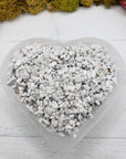 Six ounces of howlite chips in selenite bowl