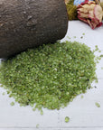 six ounces of peridot stone chips on display
