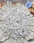 Seven ounces of crystal chips on floral display dish