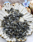 Seven ounces of labradorite stone chips on floral prop display