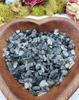 eight ounces of black tourmaline rutilated quartz in wooden bowl