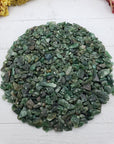Eight ounces of green aventurine chips on crystal display