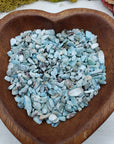 Eight ounces of Larimar chips in a wooden bowl.