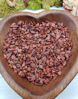 eight ounces of red jasper stone chips in wooden heart bowl