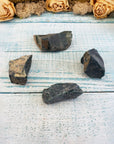 Four rough bloodstone crystal chunks on display
